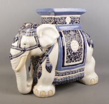 A large Oriental ceramic jardiniere formed as an elephant, decorated in blue and white. Length: