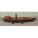 A large model Steamer boat fitted with horizontal boiler on display stand. Approx. length 130cm.