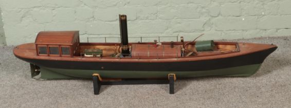 A large model Steamer boat fitted with horizontal boiler on display stand. Approx. length 130cm.