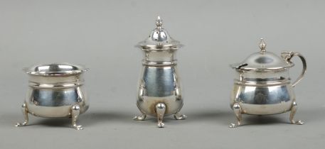 A silver three piece cruet set, including pepperette and preserve pots. Assayed for Birmingham, 1946