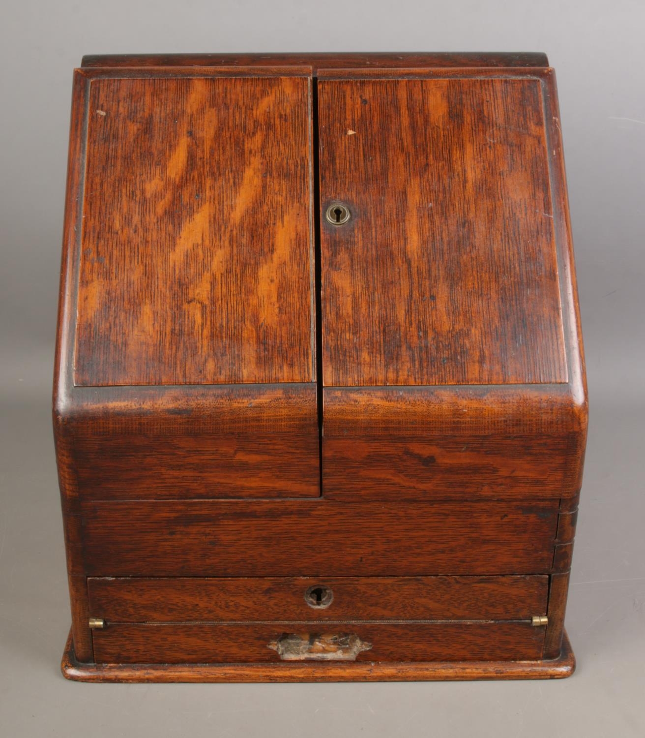 An oak stationary box with bottom draw developing into a writing slope brass handle is detached - Image 2 of 8