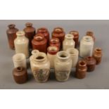 A collection of small stoneware bottles including some being labelled "Virol, A preparation of