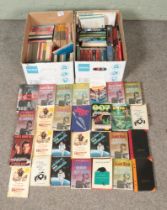 Two boxes of mostly Ian Fleming James Bond books; mainly foreign examples.