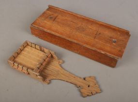 An antique ecclesiastical communion bread cutting board and dispenser, used for cutting unleavened