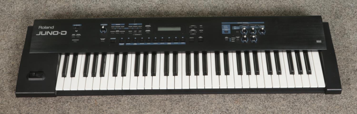 A Roland Juno-D electric keyboard.