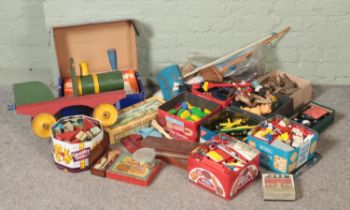 A large collection of vintage toys and games, including Meccano pieces, Lego, Carpet Bowls, tiddly