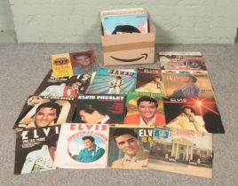 A box of Elvis vinyl records, lps etc.