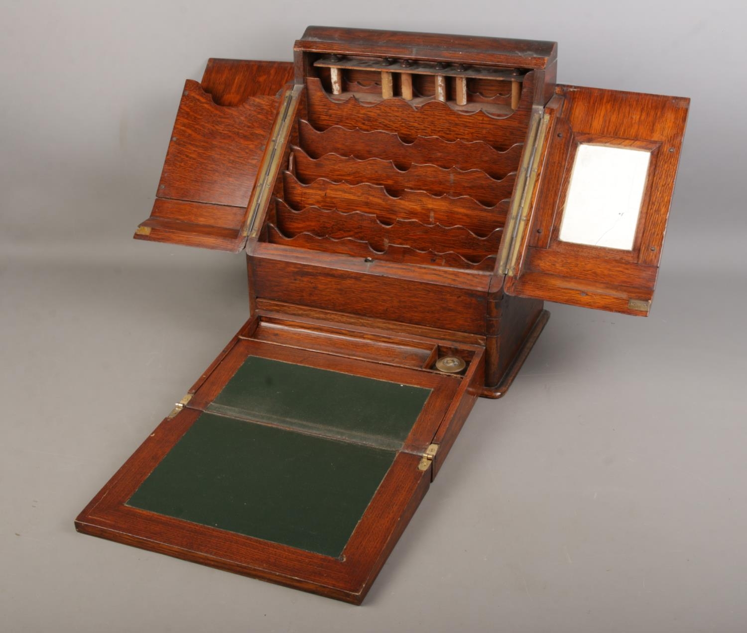 An oak stationary box with bottom draw developing into a writing slope brass handle is detached