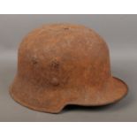 A German military helmet possibly an M34 helmet.