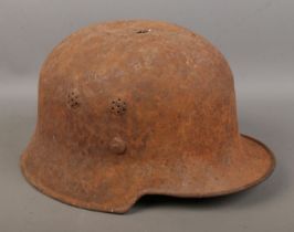 A German military helmet possibly an M34 helmet.
