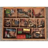 A wooden case containing a collection of mainly vintage lead figures, including Britains and