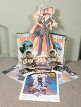 A collection of James Bond promotional items. Includes Warner Home Video Octopussy display, box