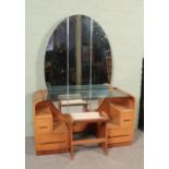 An Art Deco style G Plan E Gomme oak mirrored dressing table, with glass shelf and three piece large