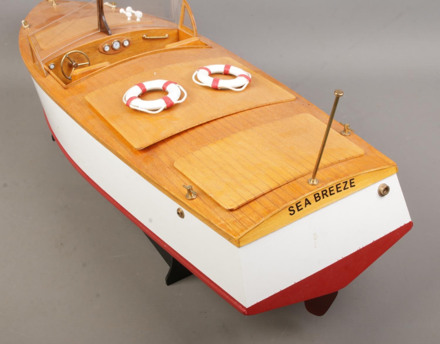 A motorised pond cruiser titled Sea Breeze on display stand. Approx. boat length 60cm. - Image 2 of 3