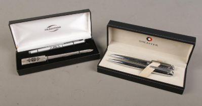 Two Sheaffer pens in case together with another pen and letter opener in case