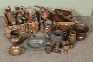 A collection of metalwares including brass and silver plate candlesticks, pewter dish, brass jug,
