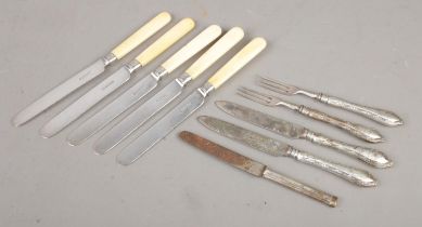 A quantity of silver collared and silver handled flatware. To include five knives produced by Joseph