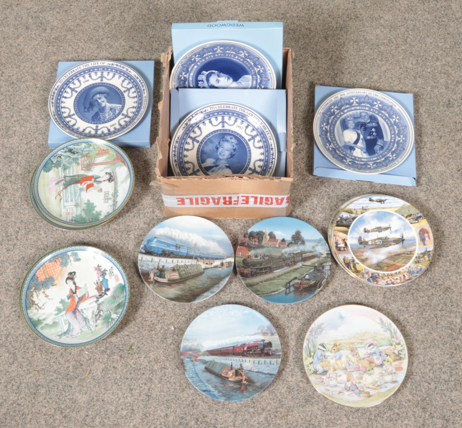 A box of ceramic cabinet plates. Includes boxed Wedgwood examples, Imperial Jingdezhen examples,