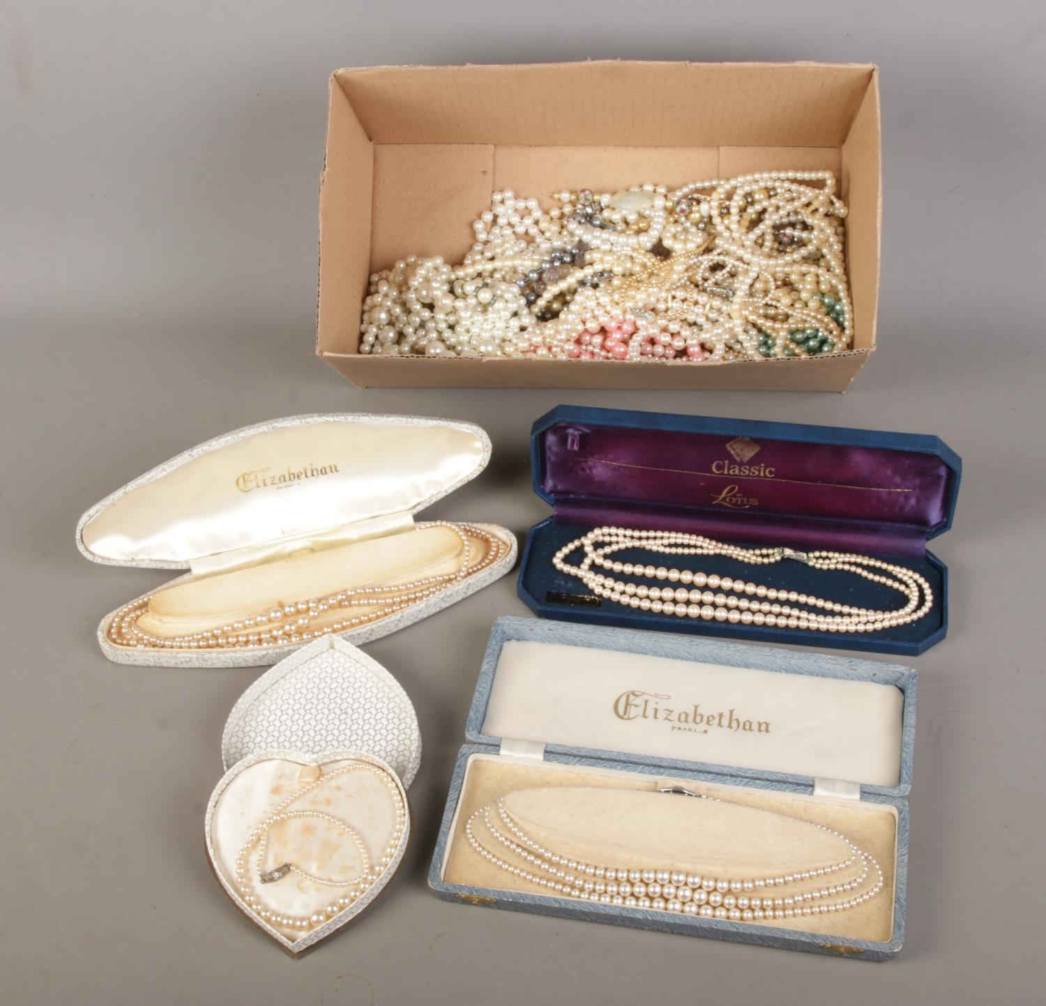 A box of simulated pearl necklaces to include silver clasped example.