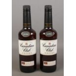 Two full and sealed bottles of Canadian Club blended whisky. Both 70cl.