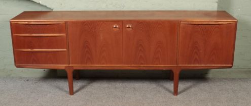 An A H McIntosh & Company teak sideboard, with arrangement of three drawers, two central cupboard
