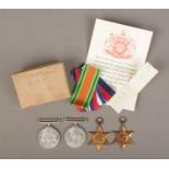 A set of four WWII medals to include 1939-45 Star, France and Germany Star, Defence Medal and War