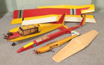 Three remote control kit model airplane gliders along with collection of glider wings.