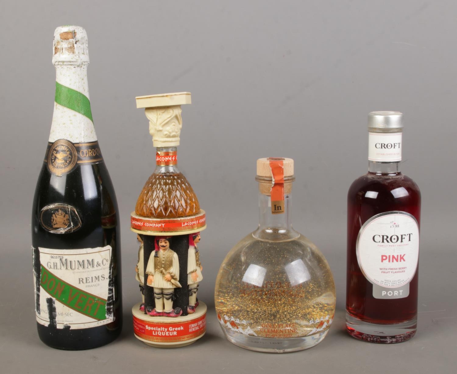 Four full and sealed bottles of alcohol. Includes Croft Pink Port, Infusionist Gold Flake