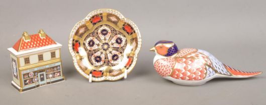 Three pieces of Royal Crown Derby ceramics; consisting of 'The China Shop', pheasant paperweight and