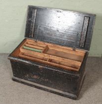 An early 20th century carpenters tool chest with fitted interior.