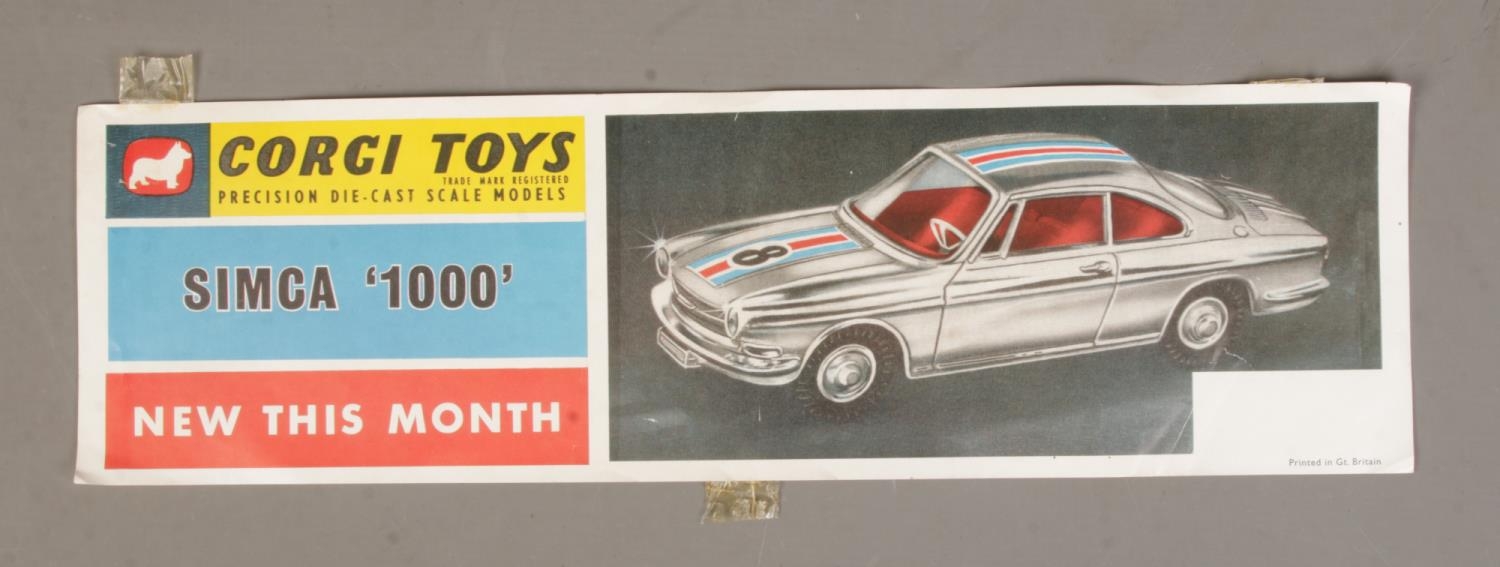 An original Corgi Toys advertising leaflet/banner for Simca '1000', New This Month. 43.5cm long.