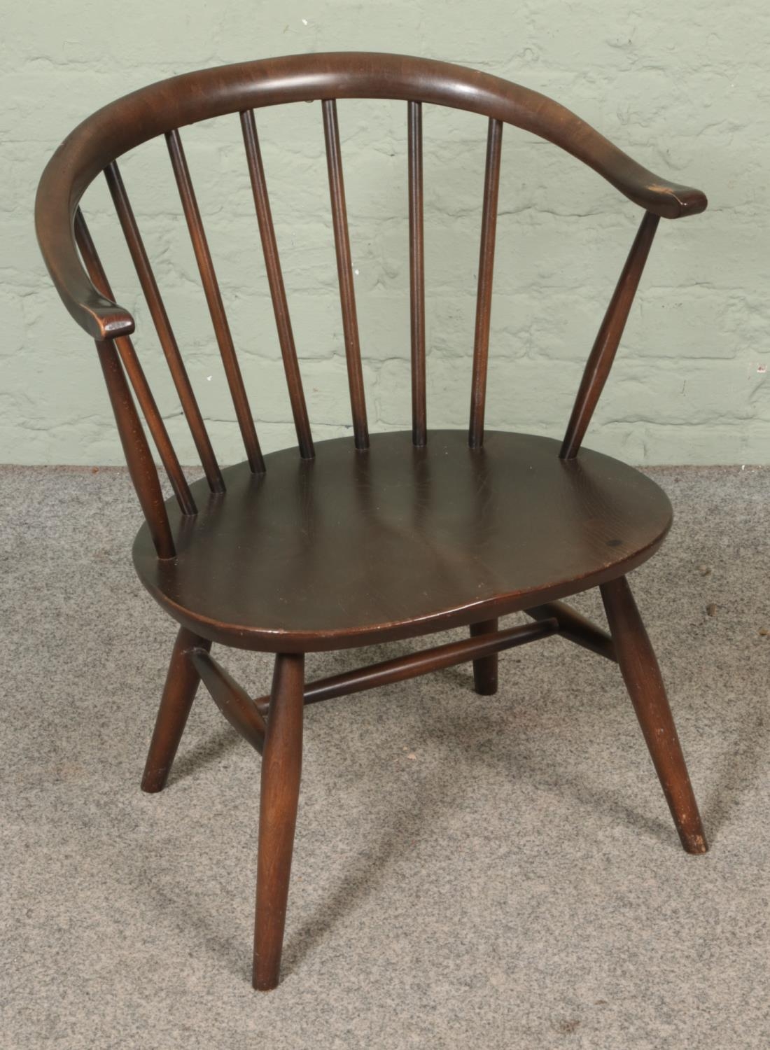 An Ercol stick back tub chair