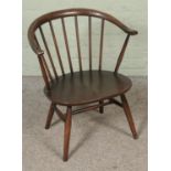 An Ercol stick back tub chair