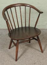 An Ercol stick back tub chair