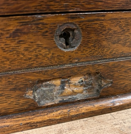 An oak stationary box with bottom draw developing into a writing slope brass handle is detached - Image 3 of 8