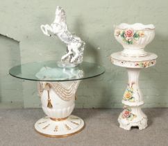 A collection of large ceramics including large glass top ceramic table, jardinière stand and large