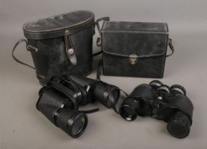 Two pairs of vintage binoculars including a Prinz and a Commodore example.