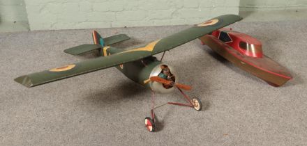Two remote control kit models to include RAF propellor plane and model speed boat.