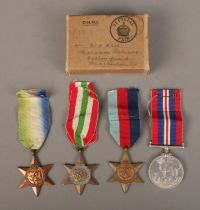 A set of four WWII medals with ribbons in box awarded to D.G Hall, Royal Navy. Includes 1939-45