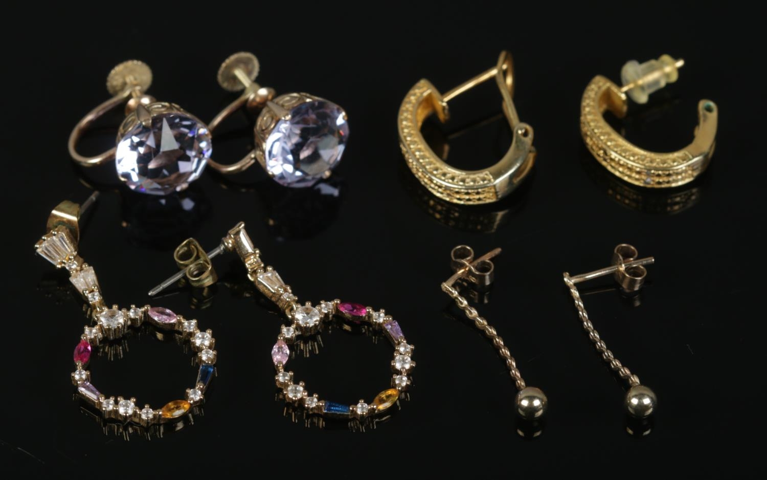 Four pairs of yellow metal earrings, to include rope twist droplet and coloured glass examples.