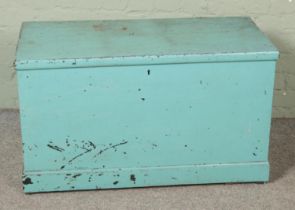 A painted pine blanket box with interior candle box drawers.