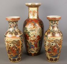 A large oriental satsuma vase with a smaller pair. Tallest Hx58cm