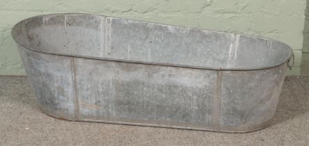 A large galvanised bath tub Length 118cm