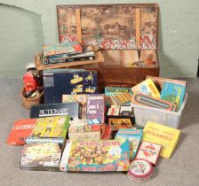 A large collection of vintage games and toys including scrabble, monopoly, dad's army board game,