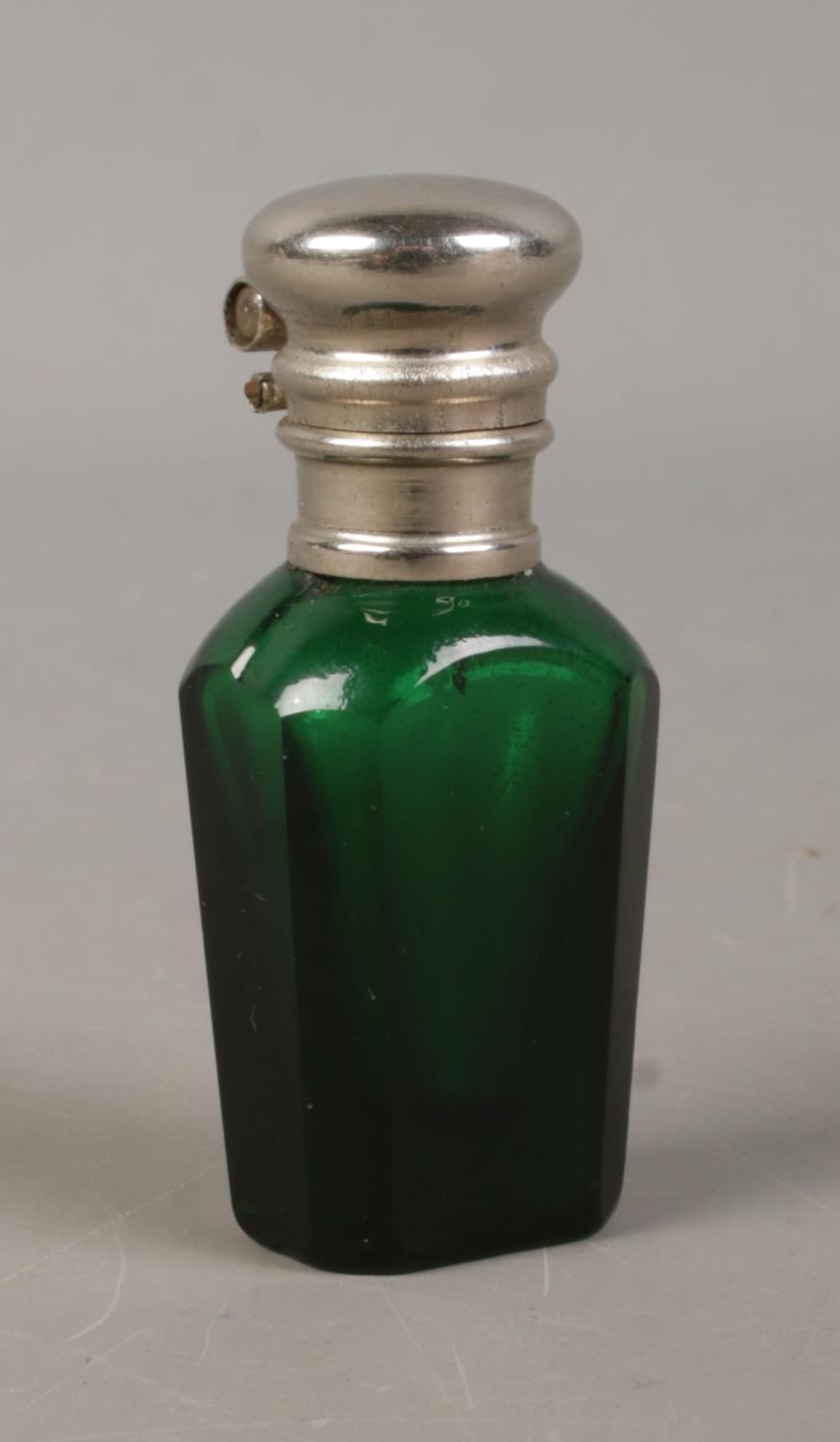 A green glass scent bottle with Stanhope depicting Lennox Castle: "In Memory of Lennoxtown and