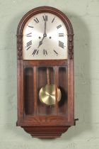 A H.A.C (Hamberg American Clock Co) wall clock with roman numeral dial.