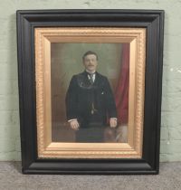A large framed oil on canvas, portrait of a suited gentleman. 53cm x 40cm.