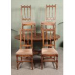 An Ercol extending dining table with set of four Old Colonial Ercol design chairs. Hx72cm Wx164cm (