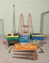 A large collection of assorted tools, to include sack barrow, G clamps, saws, tool handles, try