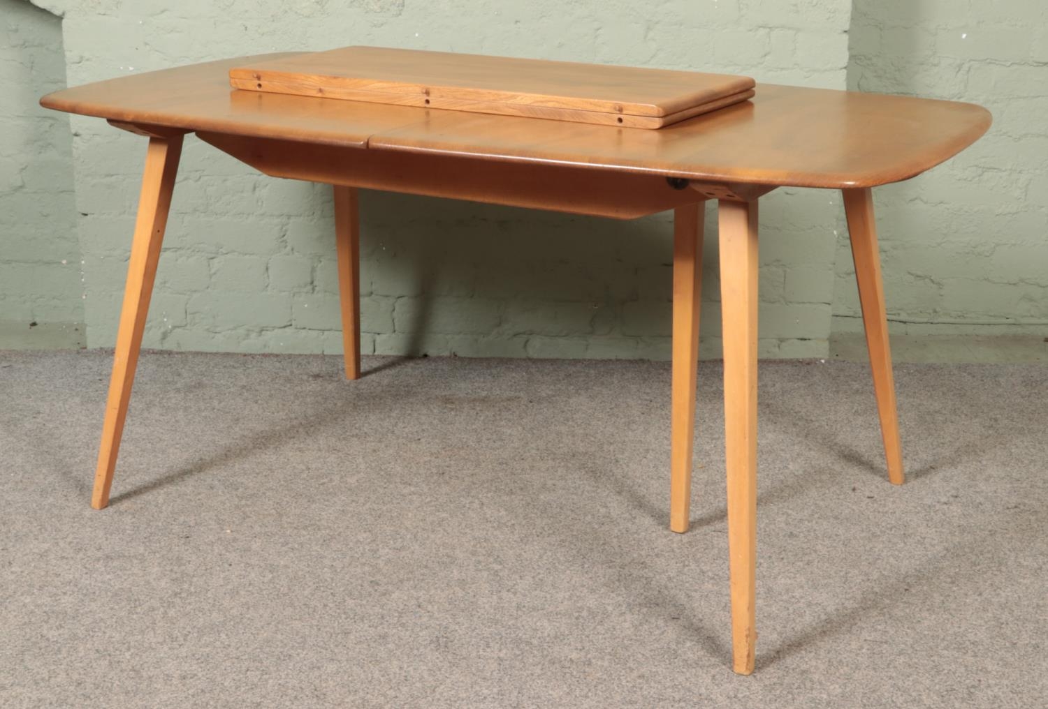 An Ercol 'Grand Windsor' light oak and ash extending dining table, with hinged additional leaf, - Image 2 of 7